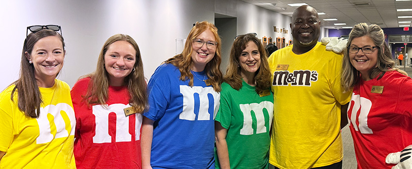 Kilby Teachers posing for a picture dressed as M&M's